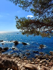 fantastic blue seascape, rocky sea coast, blue sea and blue sky