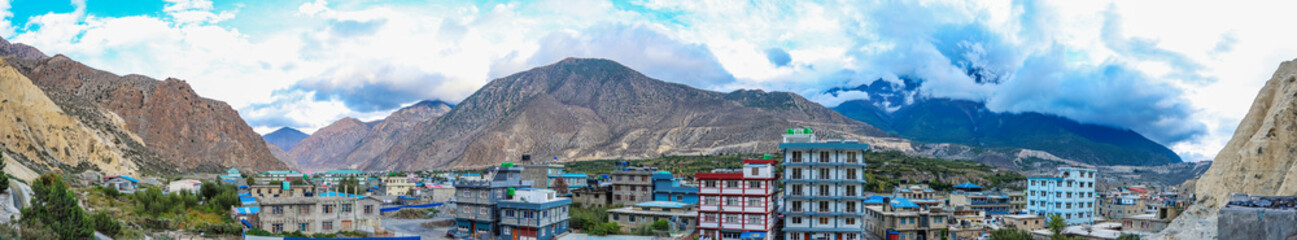 Panoramic view of Jomsom town in the Mustang District of Nepal, surrounded by the majestic Himalayas. Perfect for travel, trekking, editorial, and cultural tourism content in high-altitude regions.