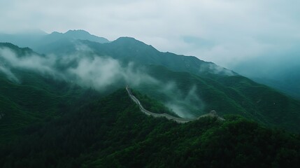 Misty mountain peaks covered in fog and clouds