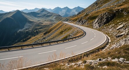Winding Mountain Road Through Alpine Landscape on a Sunny Day.