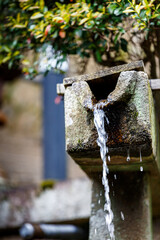 water fountain in the garden made from carved stone