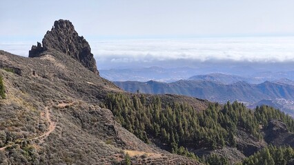 Typical mountain landscape in the center of the island, the rock in the background - Roque del Pino. Gran Canaria. Canary Islands. Spain.