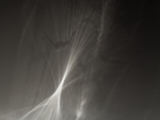 Dancing glass caustic patterns. Abstract caustic light patterns created by refraction and...