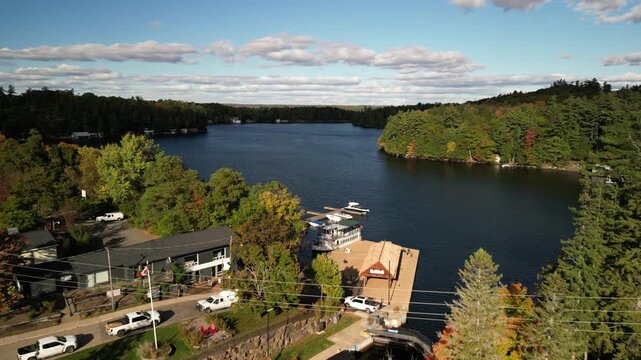 Aerial of docks in Port Carling Ontario Canada in fall on Lake Rosseau on sunny day