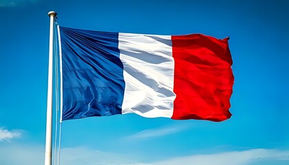 A horizontal tricolor flag with blue, white, and red vertical stripes waves against a vibrant blue sky. The flagpole is at left