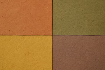 Fototapeta premium Earth Tone Paper Blocks. An abstract, geometric background of textured paper blocks in warm earth tones, creating a minimal and modern composition.