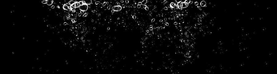 Realistic floating bubbles with detergent powder trail and fresh wave on dark backdrop.