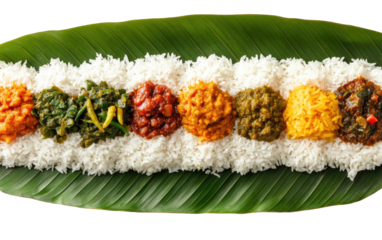 Rice with seven colorful curries served on a banana leaf platter