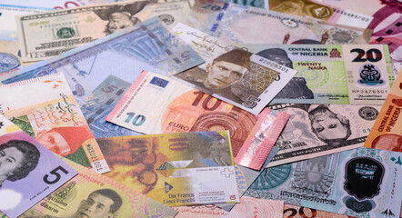 Paper money, banknotes of different countries as a business background. Paper money and cash