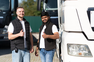 Diverse truck drivers giving thumbs up for logistics