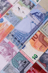 Paper money, banknotes of different countries as a business background. Paper money and cash