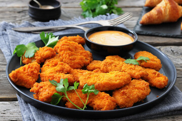 breaded chicken breast chunks with dipping sauce