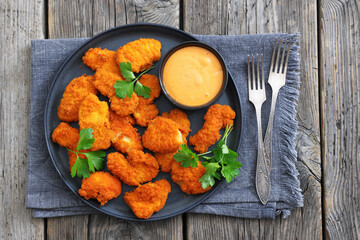 breaded chicken breast chunks with dipping sauce
