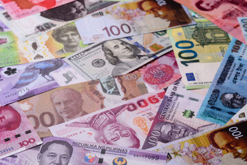 Paper money, banknotes of different countries as a business background. Paper money and cash