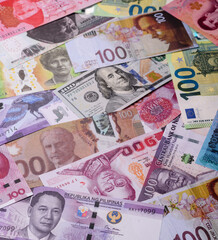 Paper money, banknotes of different countries as a business background. Paper money and cash