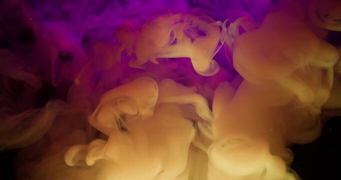 Paint cloud. Neon fume water. Defocused pink purple blue color glitter stardust splash swirl particles shiny rainbow spill on abstract dark black background.