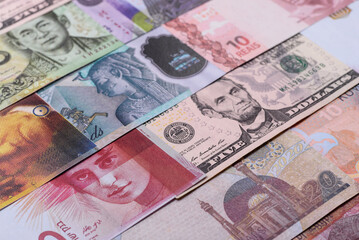 Paper money, banknotes of different countries as a business background. Paper money and cash