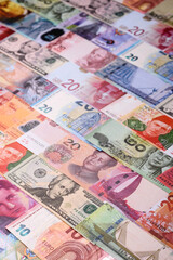 Paper money, banknotes of different countries as a business background. Paper money and cash