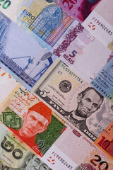 Paper money, banknotes of different countries as a business background. Paper money and cash