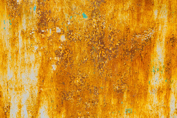 Severely rusted metal with peeling once white paint. Orange and brown tones dominate, with vertical rust streaks. Blistered and rough texture shows significant corrosion.
