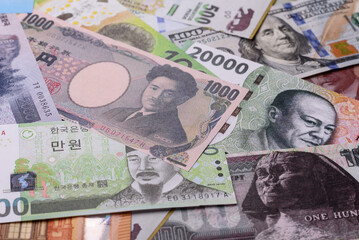 Paper money, banknotes of different countries as a business background. Paper money and cash
