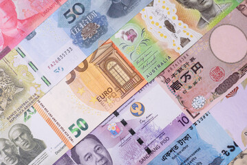 Paper money, banknotes of different countries as a business background. Paper money and cash