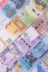 Paper money, banknotes of different countries as a business background. Paper money and cash