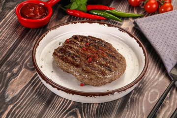 Grilled beef burger cutlet with sauce