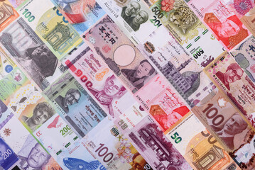Paper money, banknotes of different countries as a business background. Paper money and cash