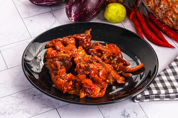 Asian cuisine - pork in chili sauce