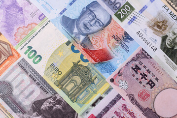 Paper money, banknotes of different countries as a business background. Paper money and cash