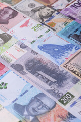 Paper money, banknotes of different countries as a business background. Paper money and cash