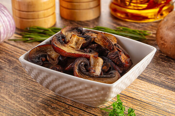 Fried champignon slices in the plate