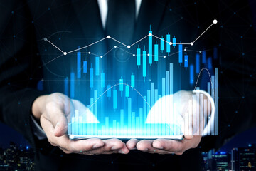A businessman holds a digital tablet displaying financial data visualizations. The background features a city skyline, highlighting the blend of technology and finance. Scalp