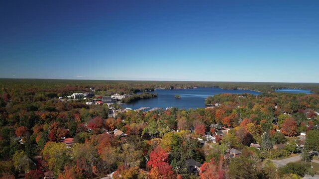 Aerial over Gull Lake and Gravenhurst Ontario Canada on sunny fall day