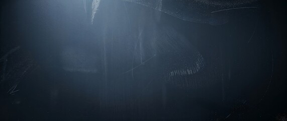 Dark blackboard background with chalk texture and dust