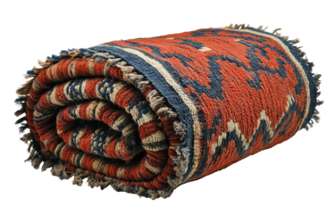 Rolled patterned rug, reddish with blue and cream accents, fringe edges