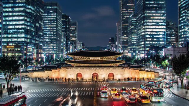 cinematic time-lapse of namdaemun gate in seoul, south korea, twilight to night. vehicle light trails, glowing buildings, blurred pedestrians. vibrant urban dynamism concept