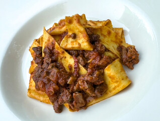 Delicious pappardelle with meat rag&ugrave; pasta. Traditional Italian food
