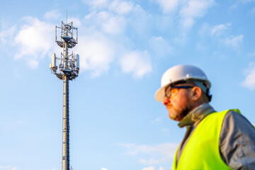 Mobile internet tower with equipment for receiving and transmitting data signals. A silhouette of a male engineer is in the foreground.