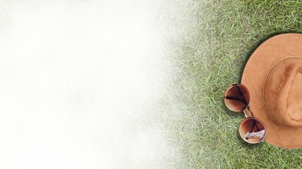 Summer grass ground Flat Lay with Straw Hat, Sunglasses, white shade Background. beach flat lay objects in summer vacation and summer concept. summer accessories, travel background.