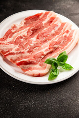 Bacon slice lard with meat slices pieces pork tenderloin portion size natural product tasty snack fresh delicious gourmet food background on the table rustic top view copy space
