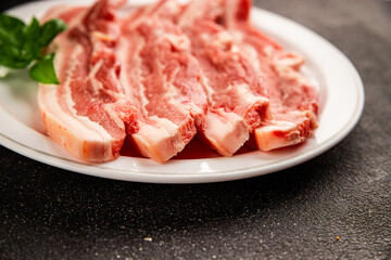 Bacon slice lard with meat slices pieces pork tenderloin portion size natural product tasty snack fresh delicious gourmet food background on the table rustic top view copy space