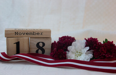 Red-white-red ribbon in the colours of the Latvian national flag. Independence Day in November.