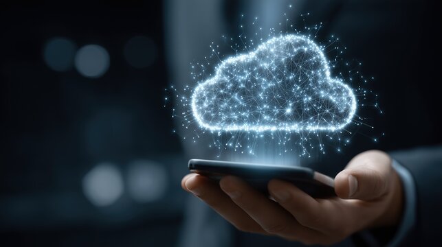 Digital cloud network hovering over a smartphone held in a business person's hand