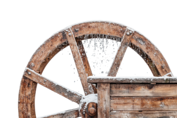 Partial view of a wooden water wheel covered in snow flakes