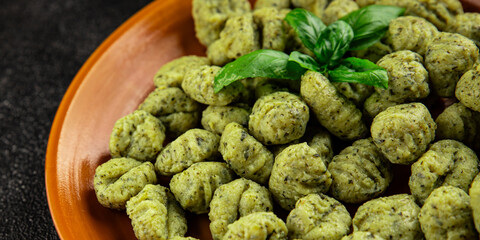 Gnocchi spinach potato dough second course portion size natural product tasty snack fresh delicious gourmet food background on the table rustic top view copy space