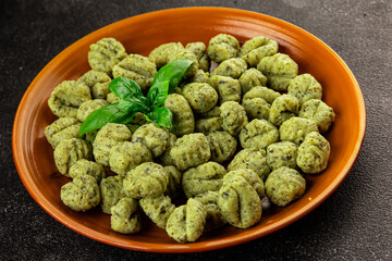 Gnocchi spinach potato dough second course portion size natural product tasty snack fresh delicious gourmet food background on the table rustic top view copy space