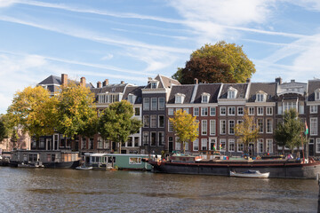 Historic canal houses along the Amstel River in Amsterdam.
