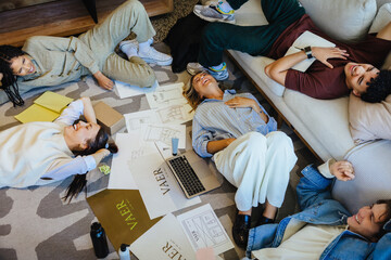 Group of young professionals brainstorming ideas in a relaxed office setting
